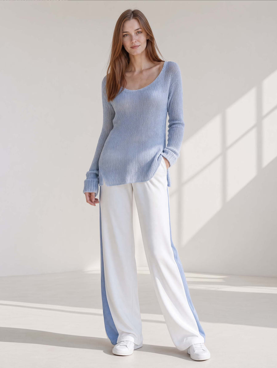 Stylish Casual Set Featuring A Long-sleeved Blue Longline Sweater And White Color-blocked Trousers