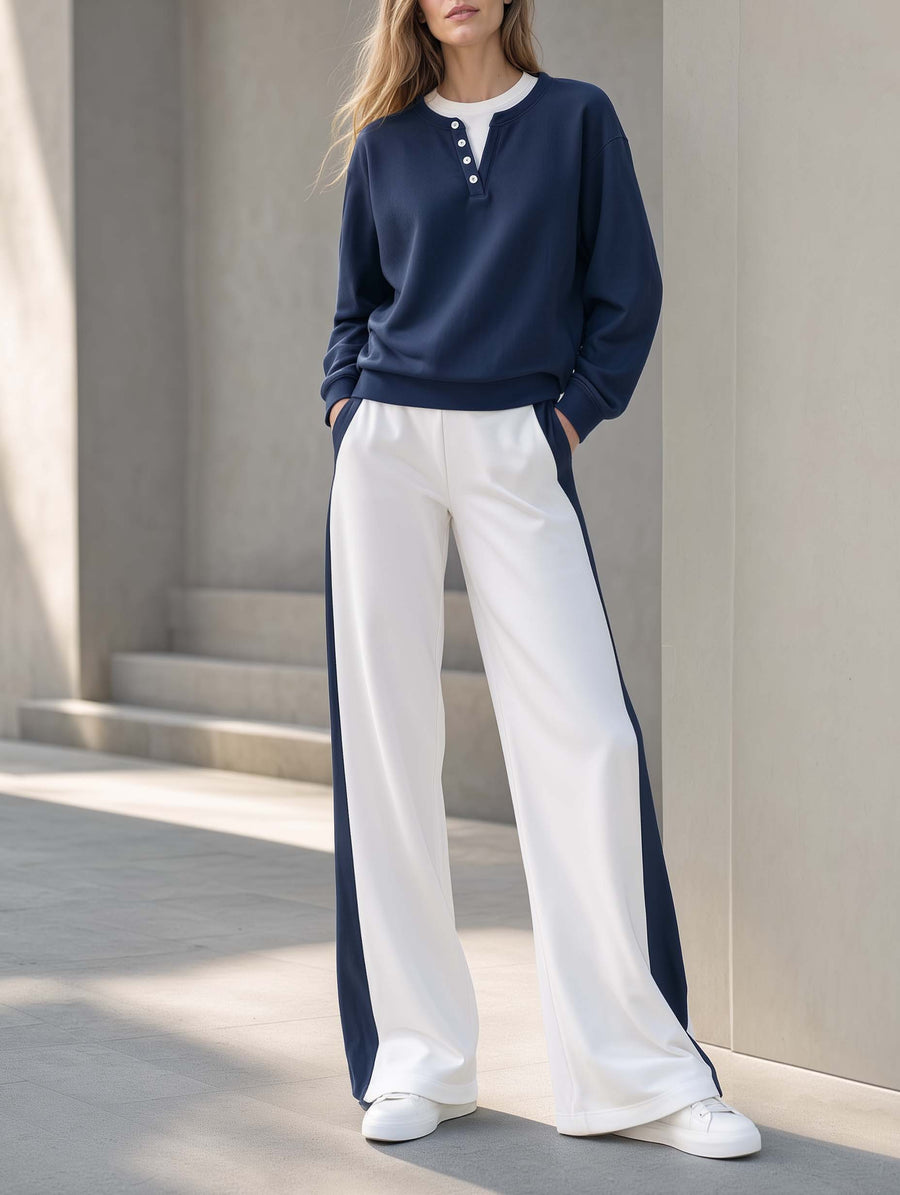 Athleisure-style Navy Blue Long-sleeve "faux-layered" Top And Color-blocked Trousers.