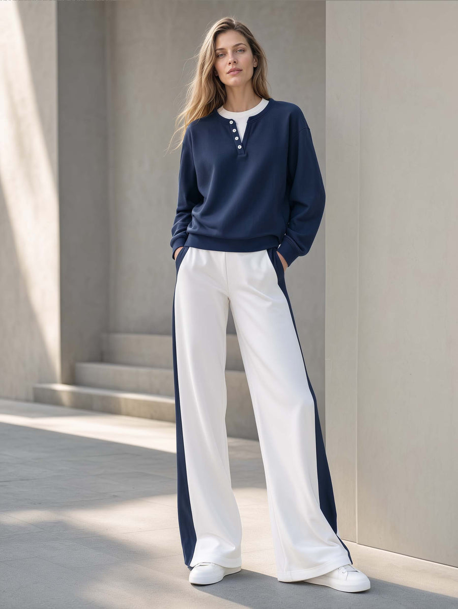 Athleisure-style Navy Blue Long-sleeve "faux-layered" Top And Color-blocked Trousers.