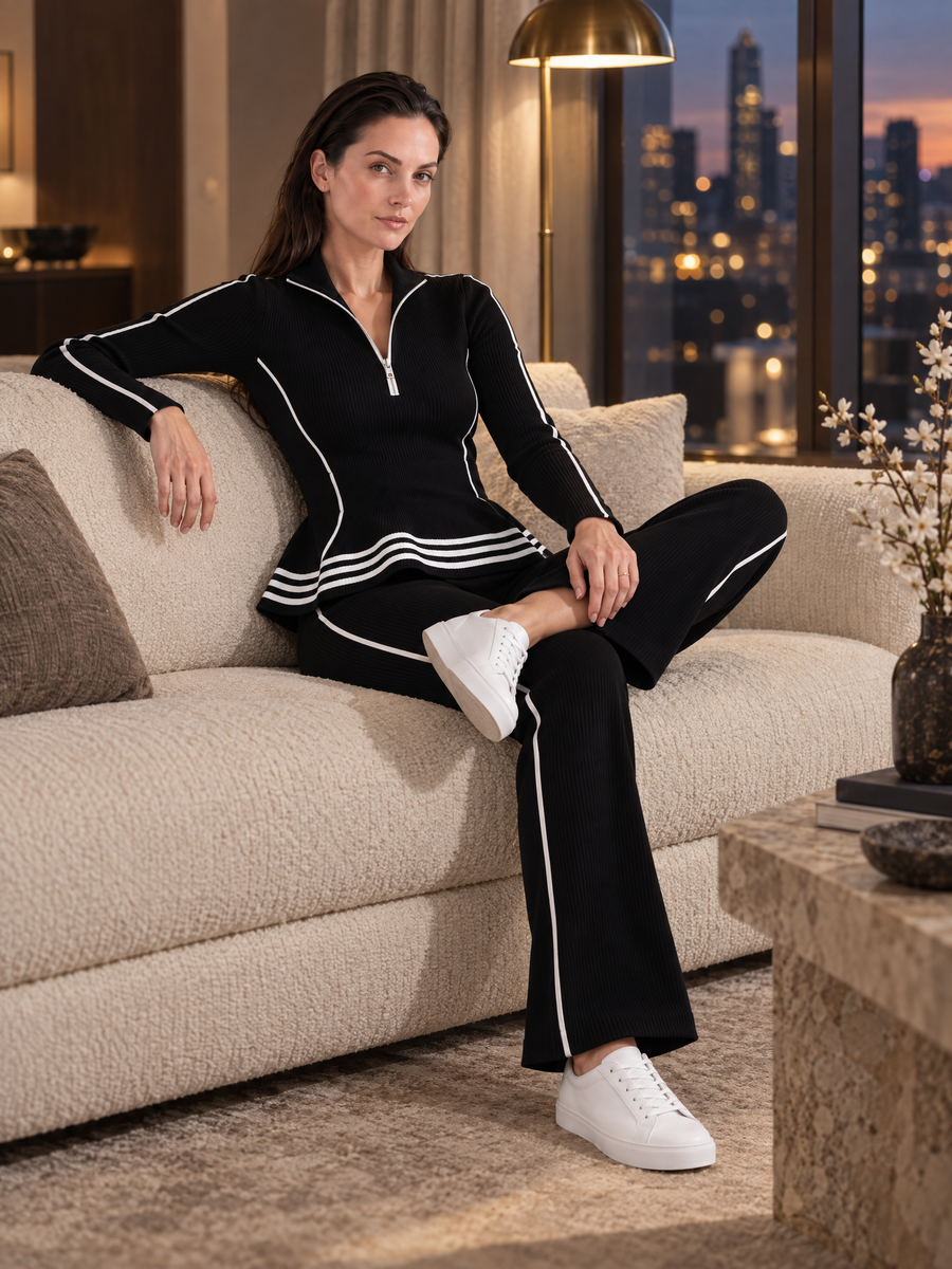 Black Knit Top With Ruffled Hem And Flared Trousers Set